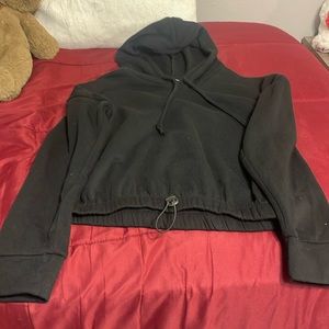 I am selling this a black cropped hoodie from Fashion Nova